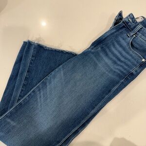 PAIGE High-Rise Mid Wash Blue Jeans with Raw Hem
